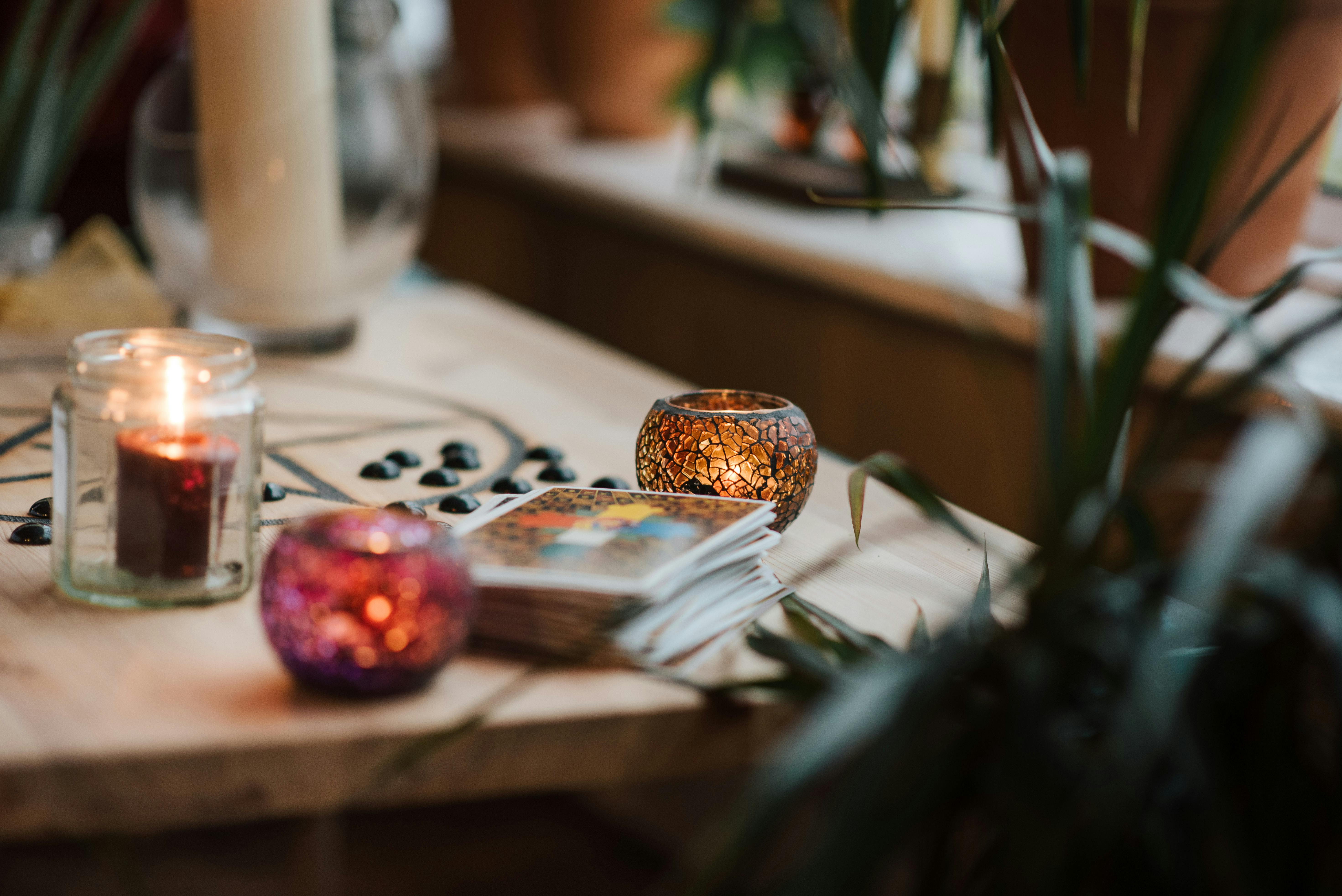 Tarot cards and candles on a sacred altar